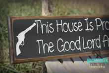 Load image into Gallery viewer, This House Is Protected By The Good Lord And A Gun