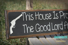 Load image into Gallery viewer, This House Is Protected By The Good Lord And A Gun
