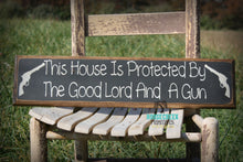 Load image into Gallery viewer, This House Is Protected By The Good Lord And A Gun
